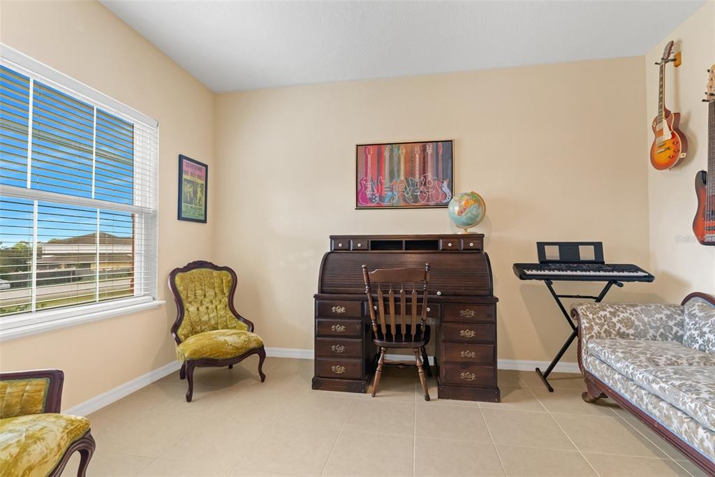 6283 Grapewood Road Spring Hill, FL 34609 - Photo 10 of 41 a living room with furniture and a window