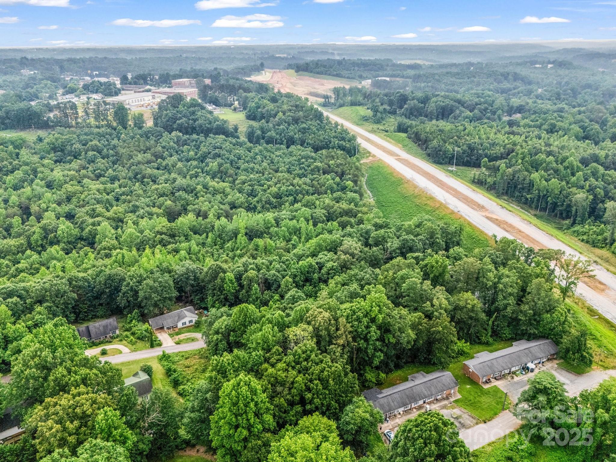 0 Hutchins Drive, Unit 14 15 Rutherfordton, NC 28139 - Photo 13 of 26 an aerial view of residential houses with outdoor space and trees