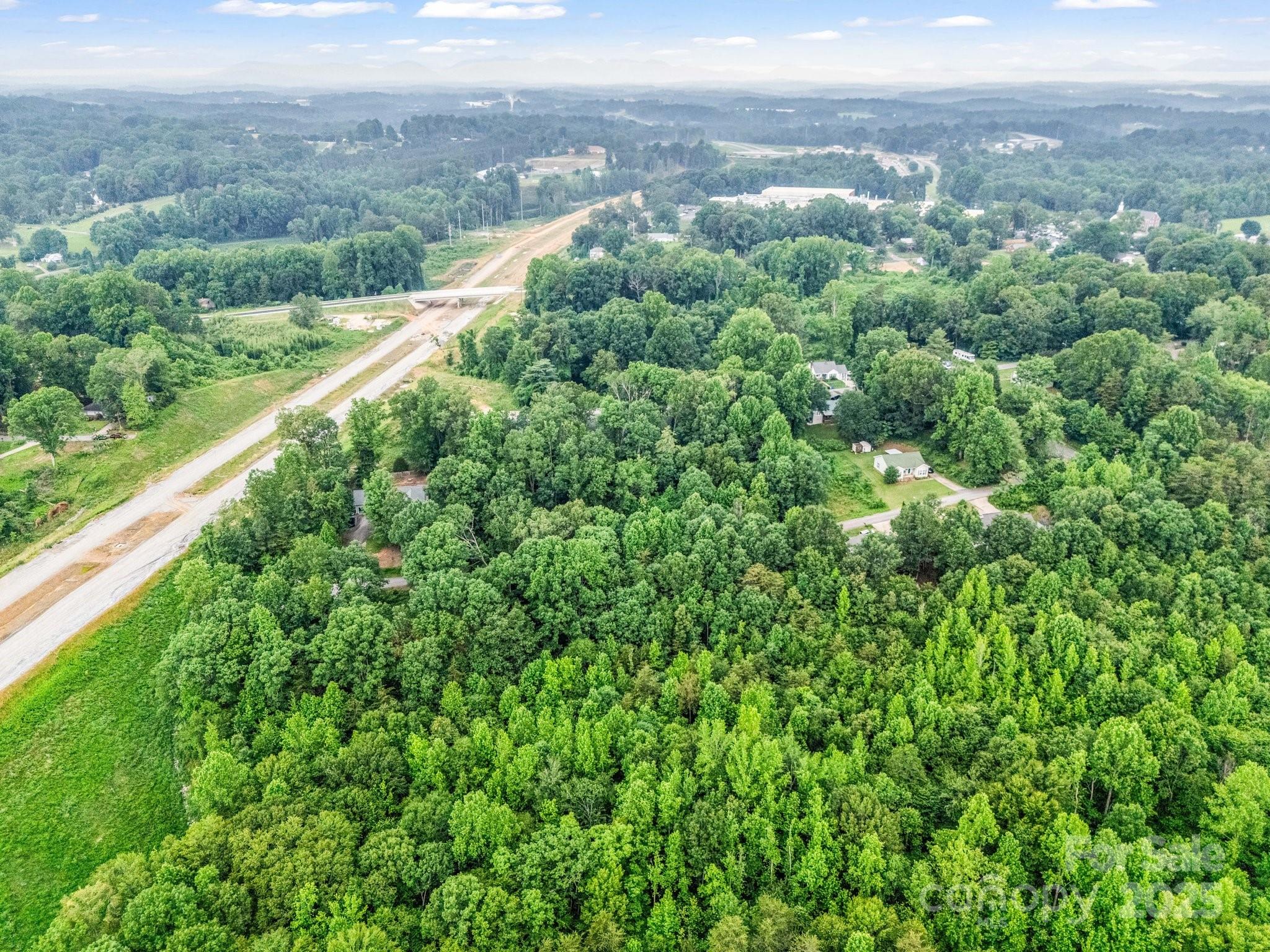 0 Hutchins Drive, Unit 14 15 Rutherfordton, NC 28139 - Photo 8 of 26 a view of a city with lush green forest