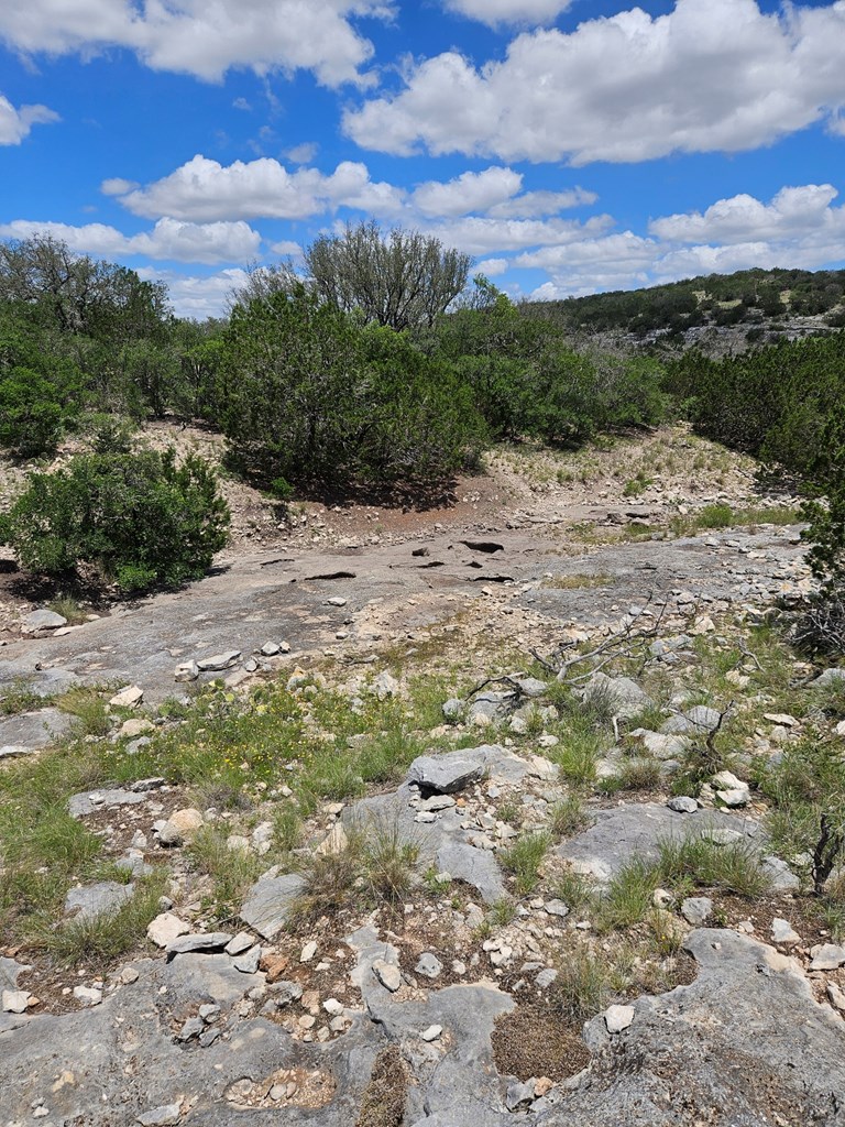 1100 Sd 45405 Rocksprings, TX 78880 - Photo 19 of 26 a view of a lake with mountains in the background