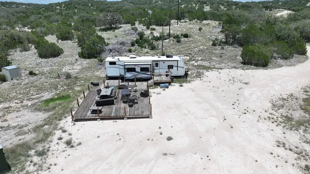a view of a patio with table and chairs with wooden floor
