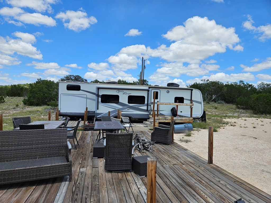 1100 Sd 45405 Rocksprings, TX 78880 - Photo 3 of 26 a view of a patio with table and chairs with wooden floor