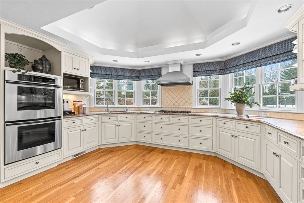 169 Hampshire Road Wellesley, MA 02481 - Photo 13 of 42 a kitchen with stainless steel appliances a stove sink and microwave