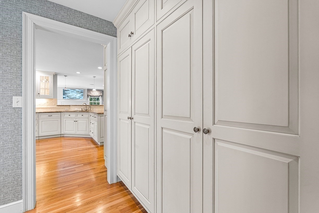 169 Hampshire Road Wellesley, MA 02481 - Photo 21 of 42 a view of a hallway with wooden floor and a bathroom