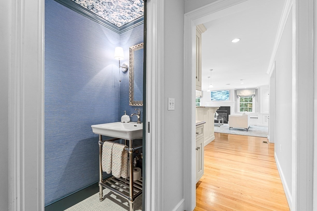 169 Hampshire Road Wellesley, MA 02481 - Photo 22 of 42 a view of a hallway with wooden floor and furniture