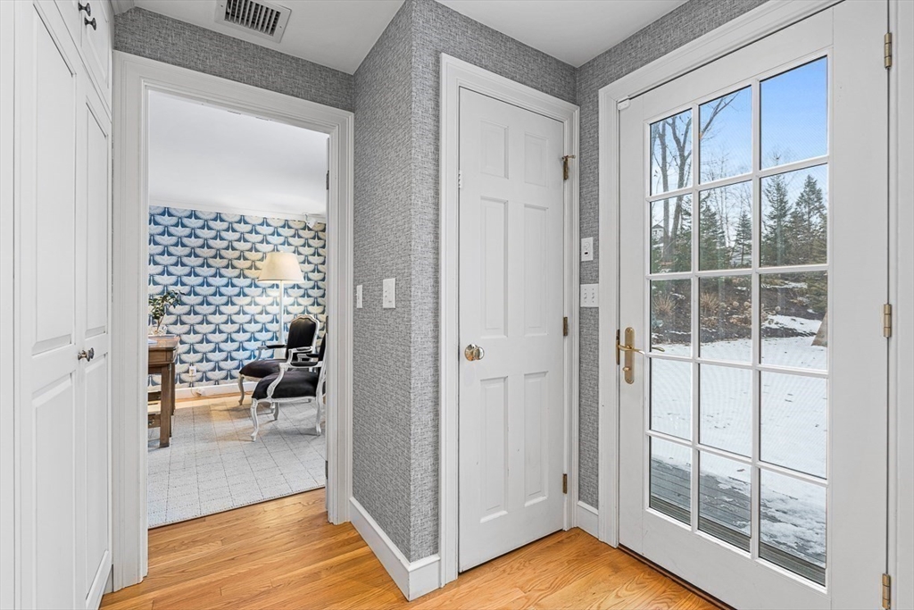 169 Hampshire Road Wellesley, MA 02481 - Photo 23 of 42 a view of a hallway and dining room with furniture