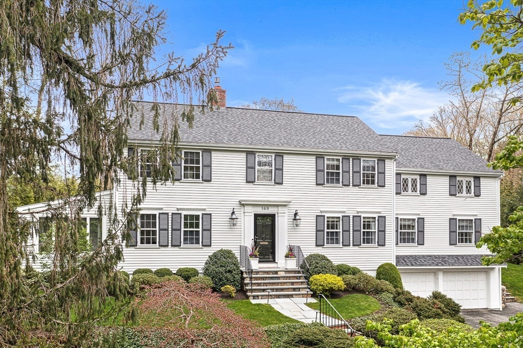 169 Hampshire Road Wellesley, MA 02481 - Photo 3 of 42 a front view of a house with a garden
