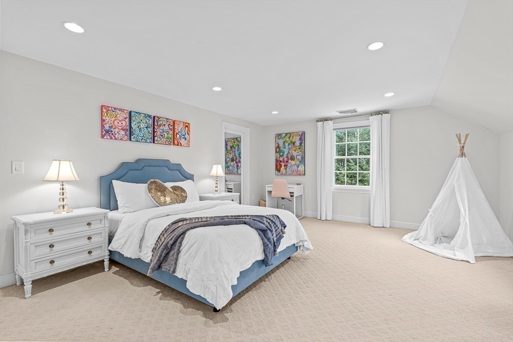 169 Hampshire Road Wellesley, MA 02481 - Photo 33 of 42 a spacious bedroom with a bed and a window