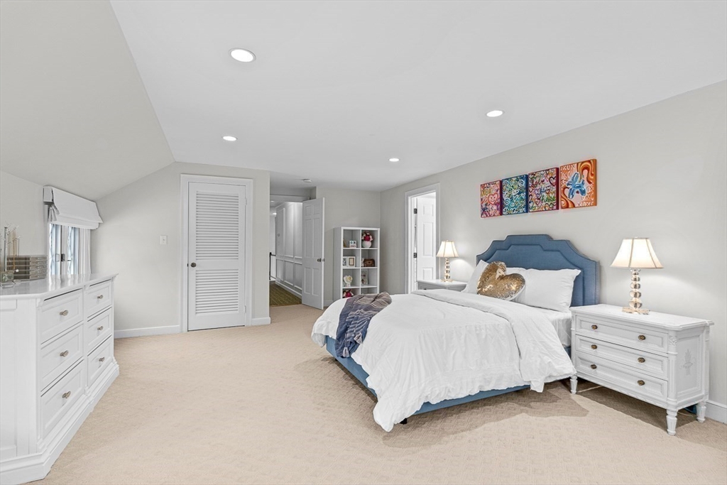 169 Hampshire Road Wellesley, MA 02481 - Photo 35 of 42 a bedroom with a large bed and a tv