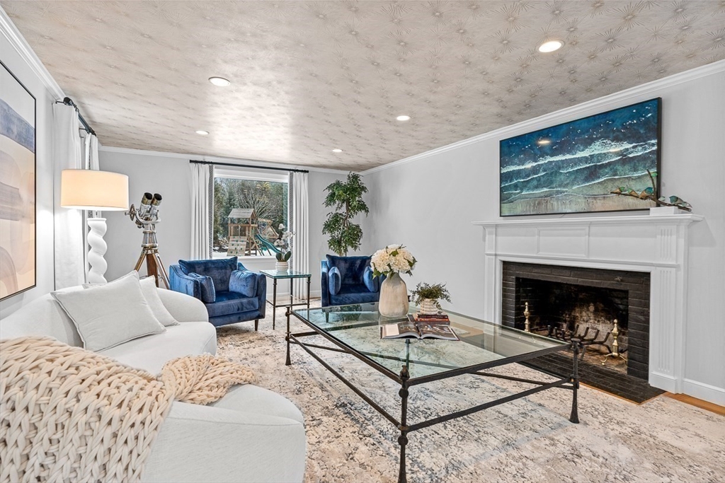 169 Hampshire Road Wellesley, MA 02481 - Photo 8 of 42 a living room with furniture a table and a fireplace