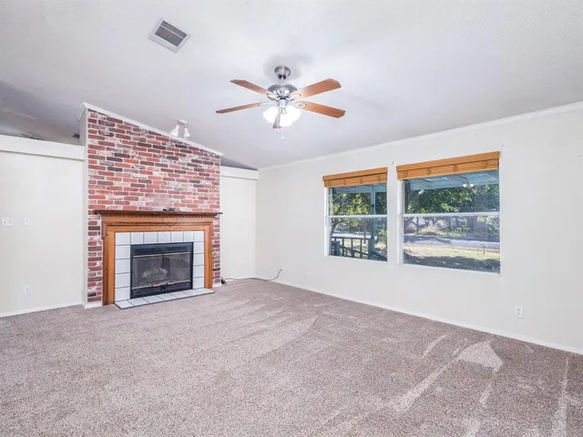a kitchen with stainless steel appliances granite countertop a sink and a refrigerator
