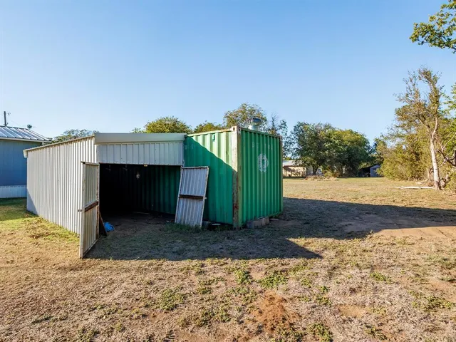 a view of house with yard
