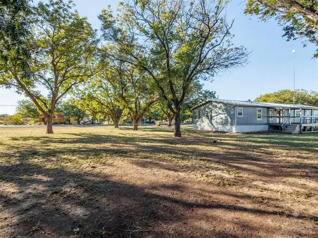 a view of a house with a big yard