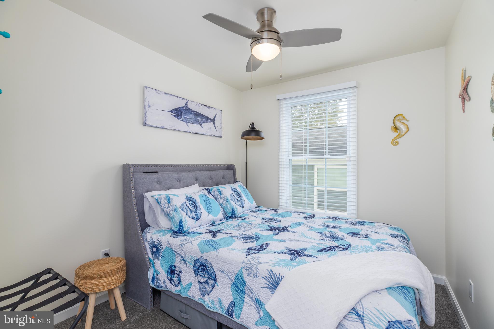 28016 Possum Point Road Millsboro, DE 19966 - Photo 19 of 70 a bedroom with a bed and a window