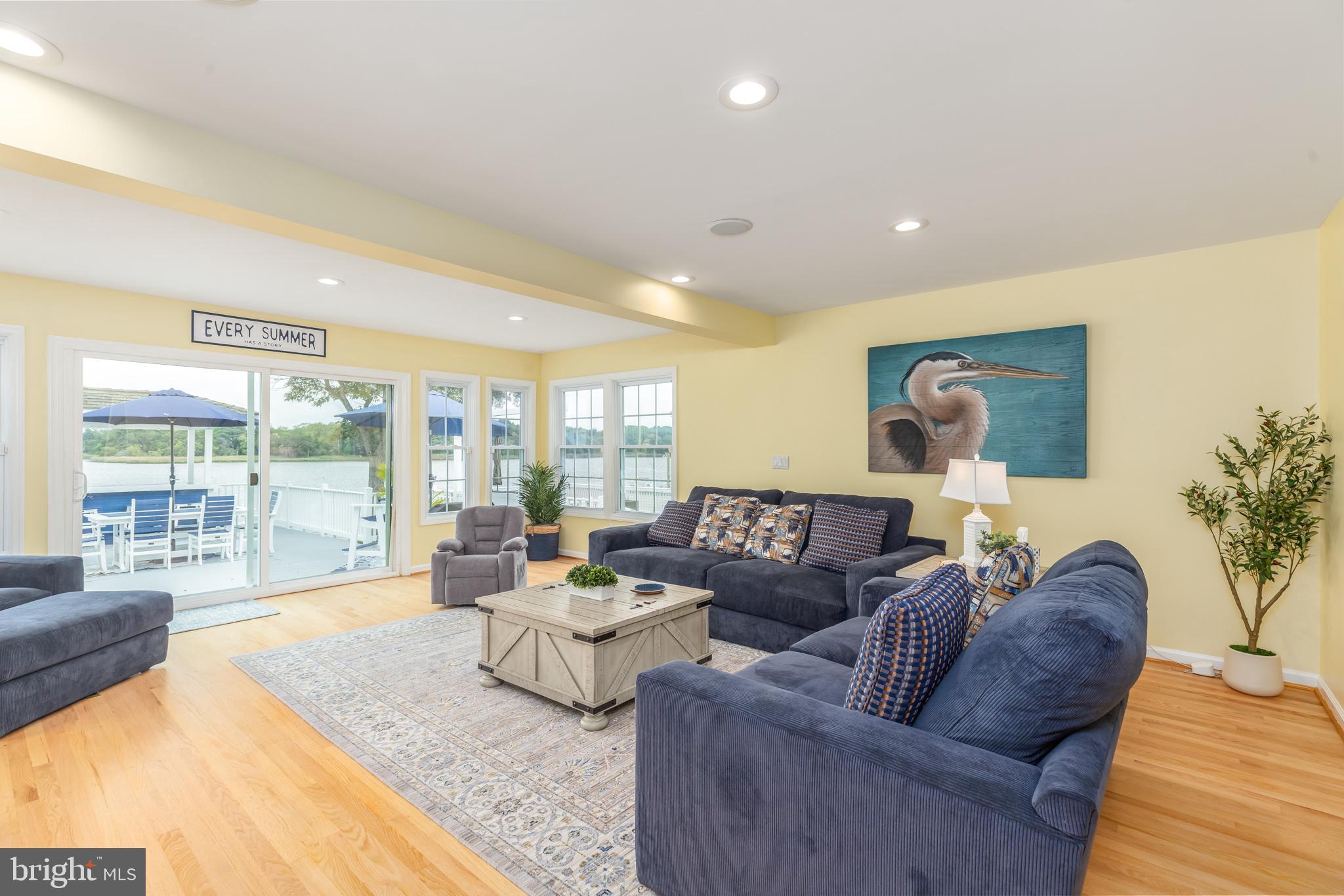 28016 Possum Point Road Millsboro, DE 19966 - Photo 21 of 70 a living room with furniture and a large window