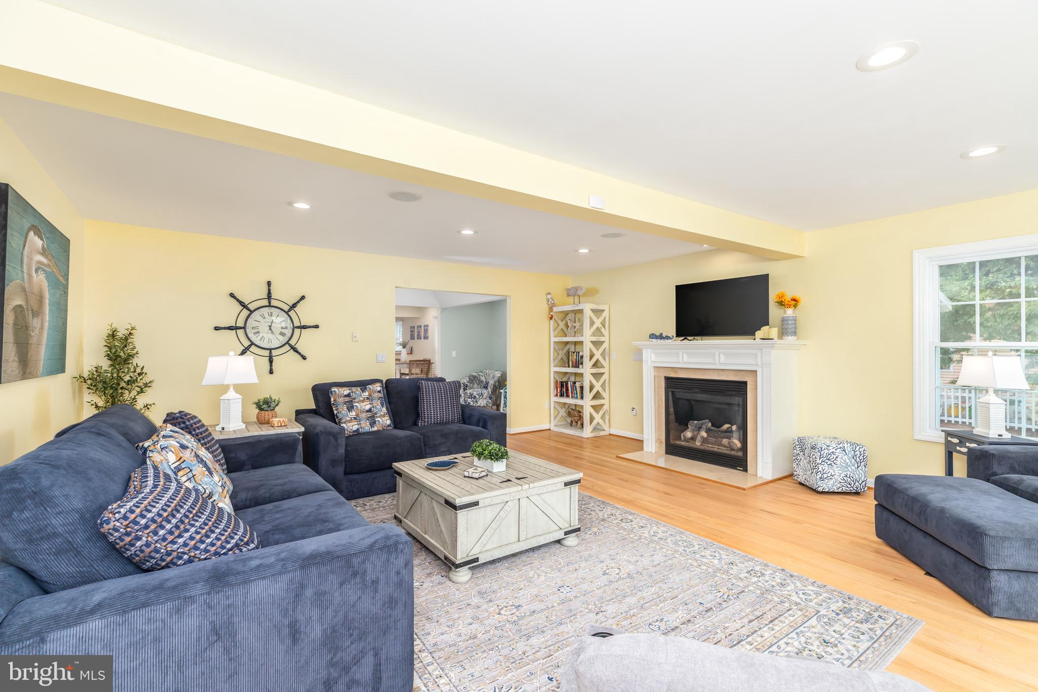 28016 Possum Point Road Millsboro, DE 19966 - Photo 25 of 70 a living room with furniture and a fireplace