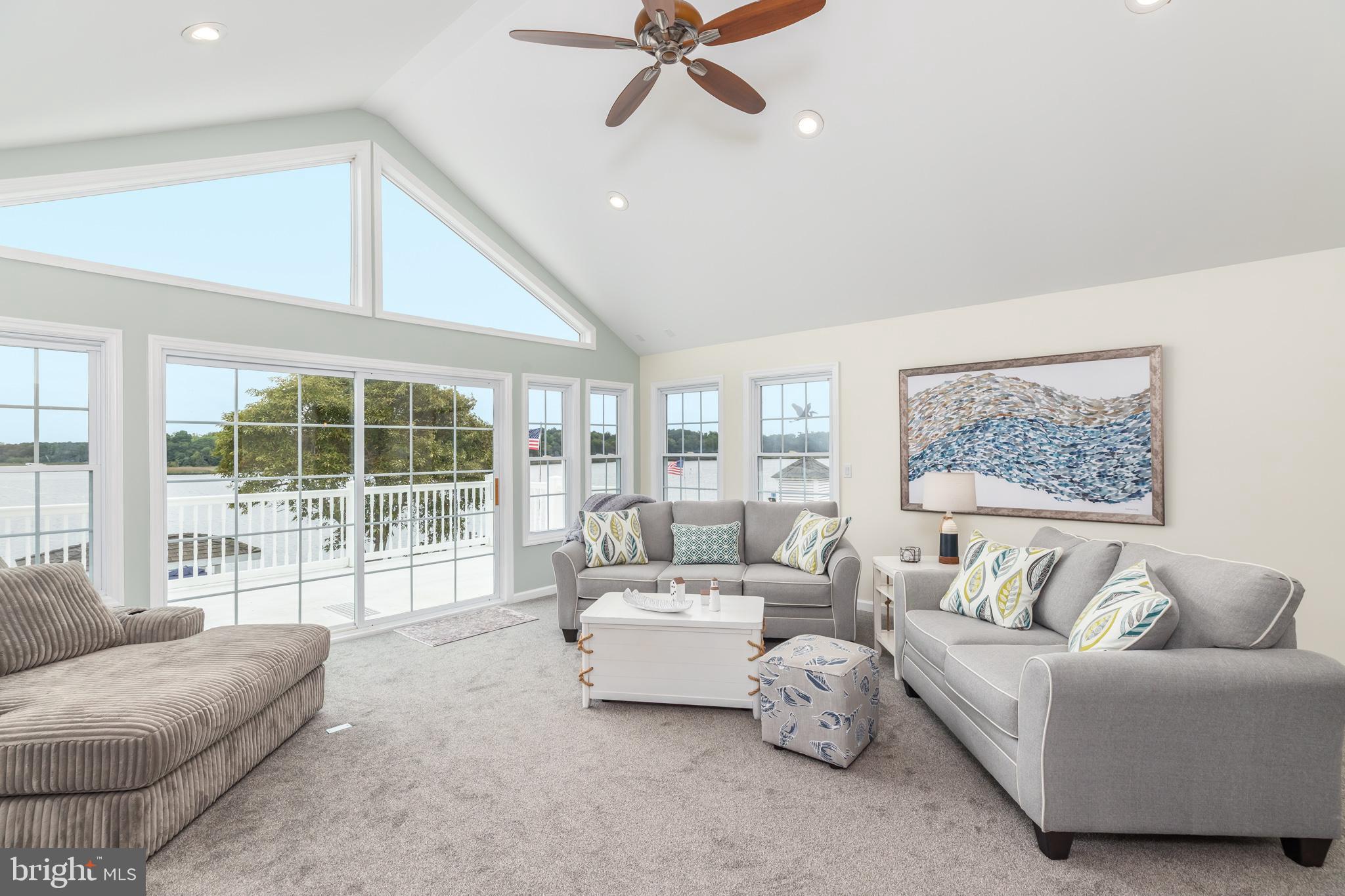 28016 Possum Point Road Millsboro, DE 19966 - Photo 30 of 70 a living room with furniture and a large window