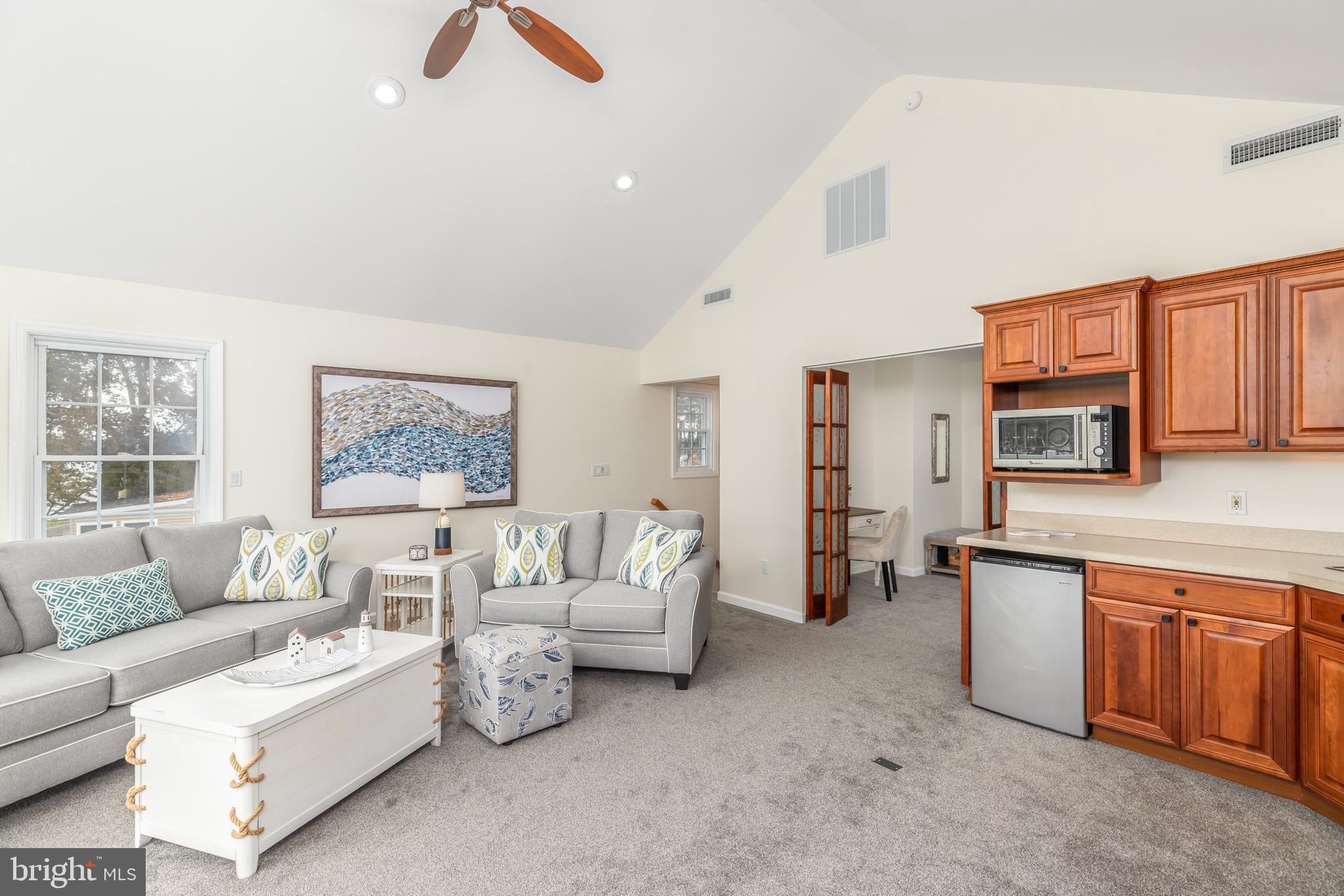 28016 Possum Point Road Millsboro, DE 19966 - Photo 31 of 70 a living room with furniture and a couch