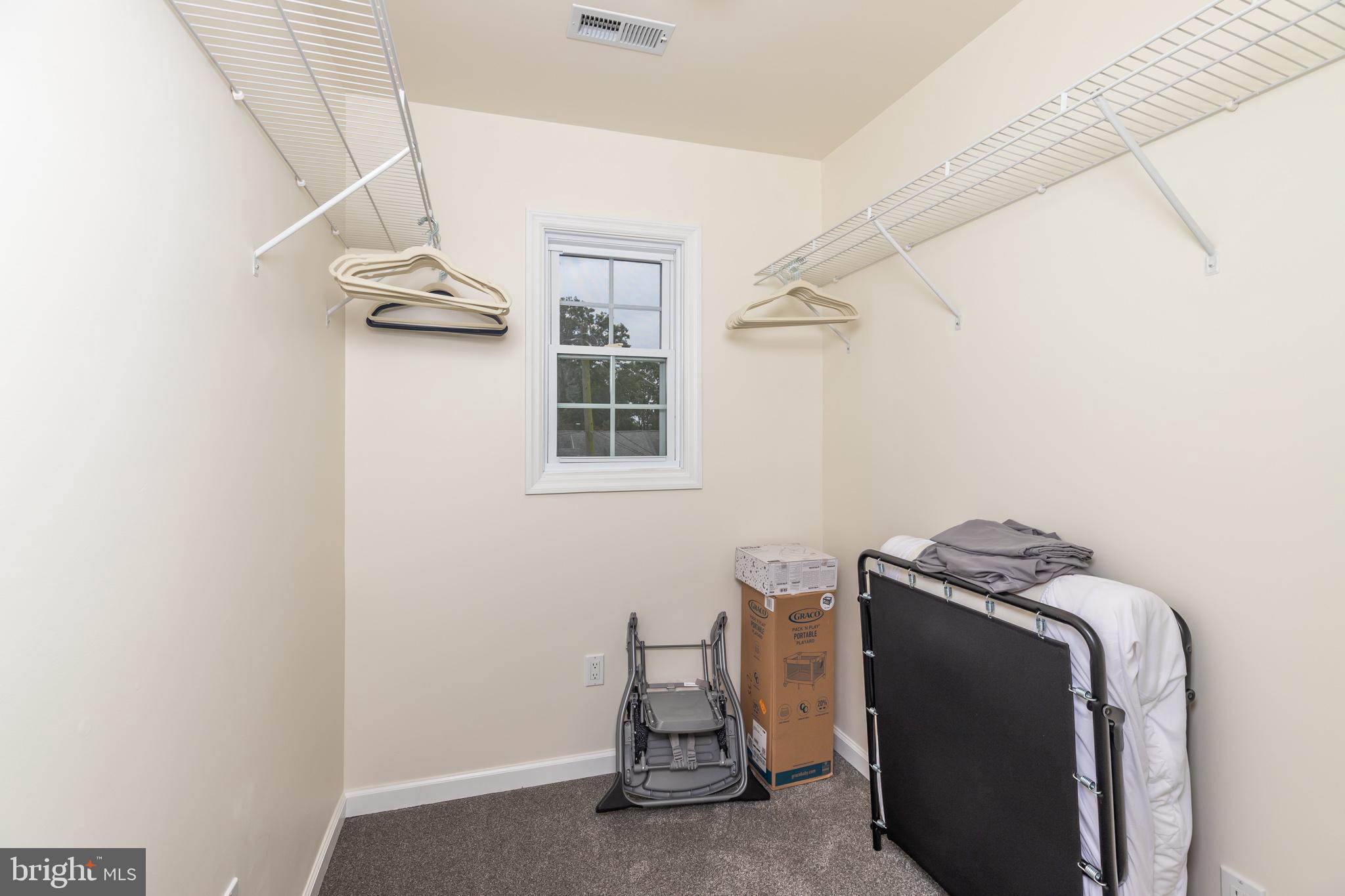 28016 Possum Point Road Millsboro, DE 19966 - Photo 43 of 70 a view of a livingroom with an empty space and a window