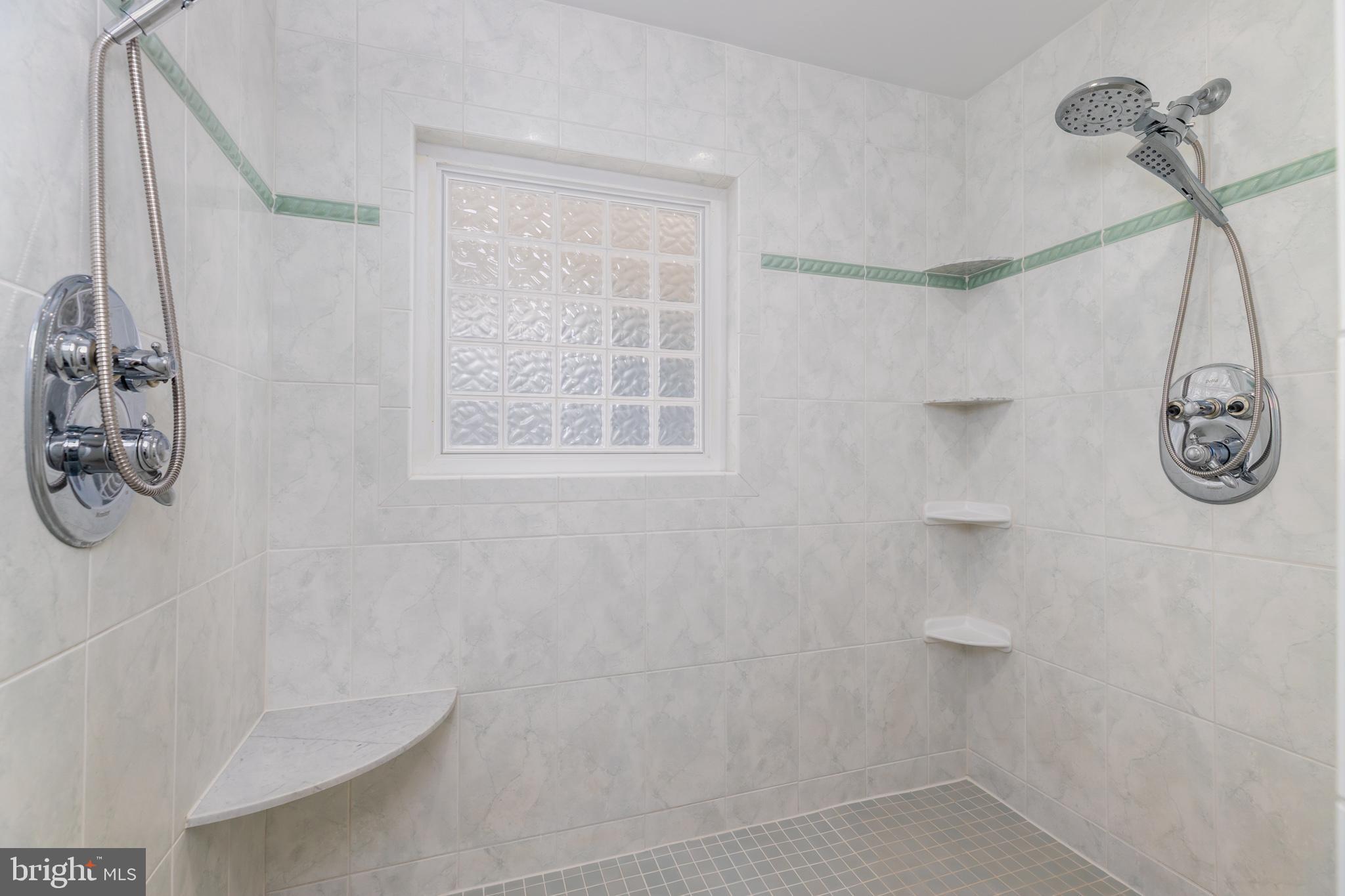 28016 Possum Point Road Millsboro, DE 19966 - Photo 45 of 70 a bathroom with a shower and a window