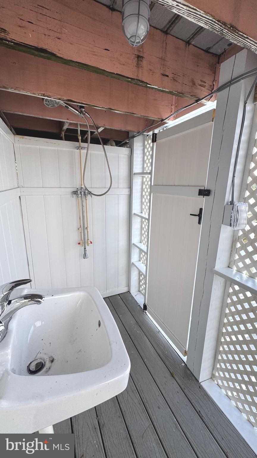 28016 Possum Point Road Millsboro, DE 19966 - Photo 66 of 70 a bathroom with a bathtub and shower