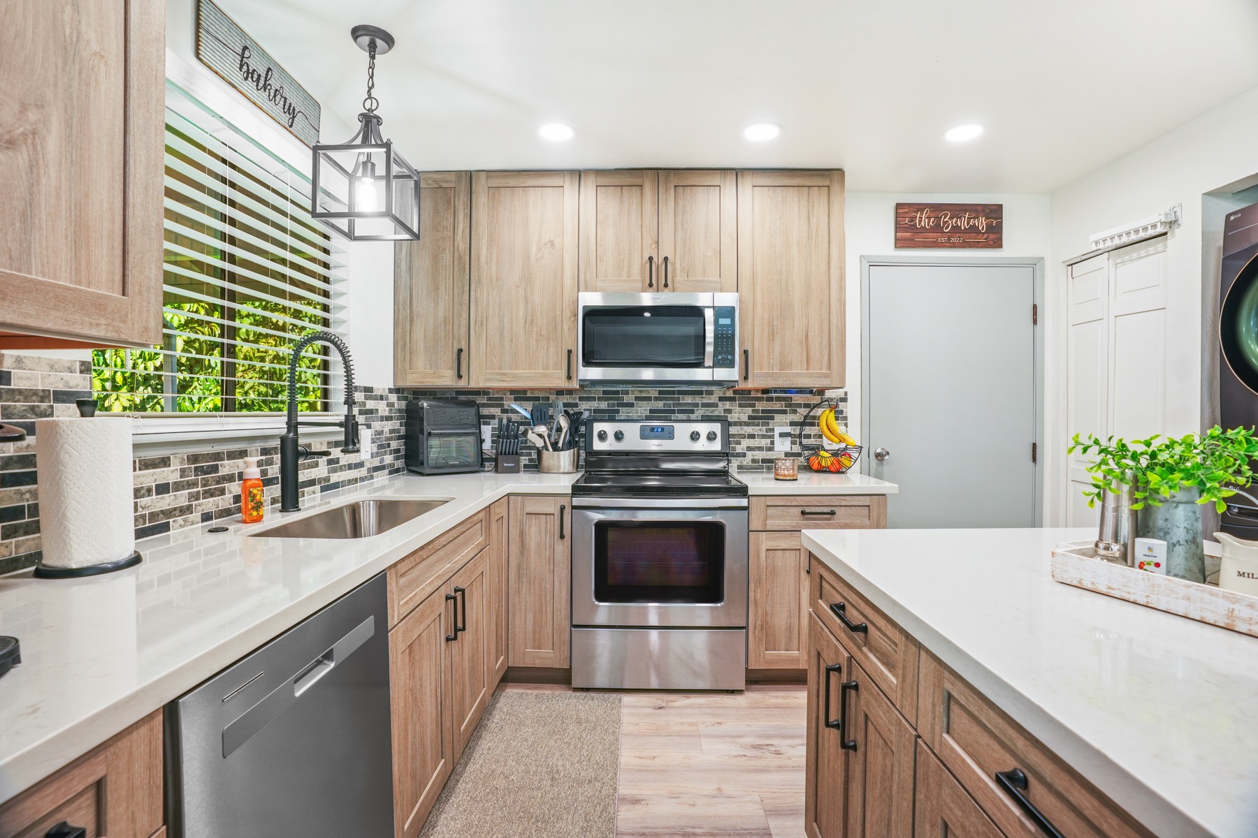 a kitchen with a sink stove and refrigerator