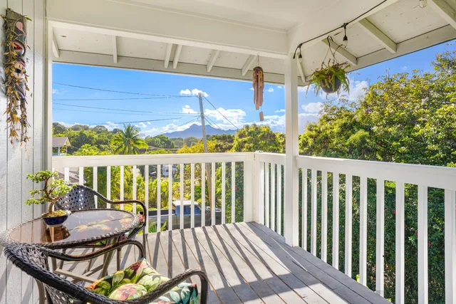 a view of a balcony with chairs