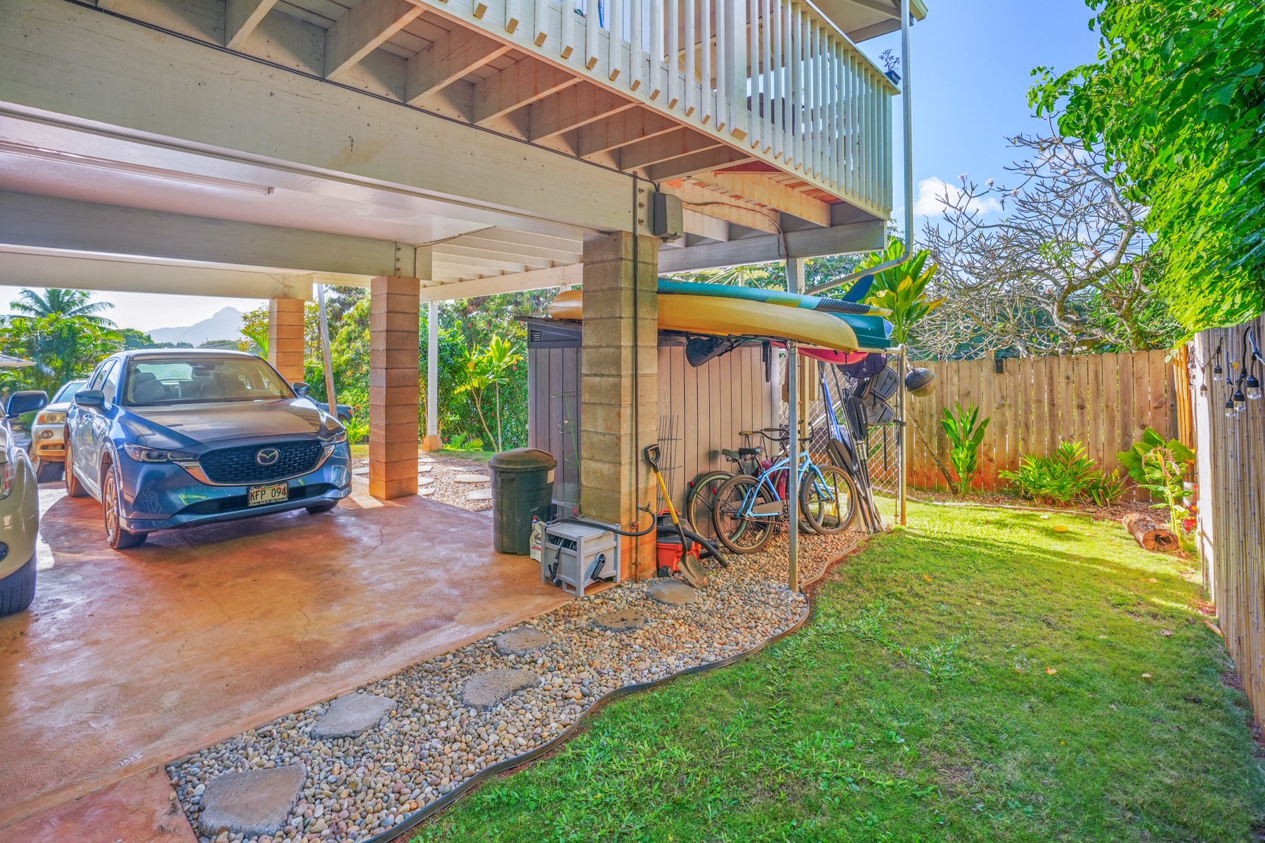 4940 A Hauaala Road Kapaa, HI 96746 - Photo 16 of 22 a view of a backyard with table and chairs and a barbeque