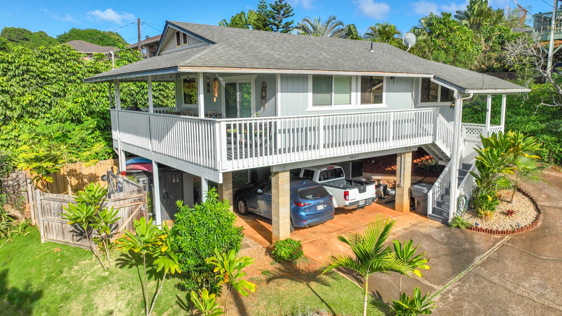 4940 A Hauaala Road Kapaa, HI 96746 - Photo 19 of 22 a front view of a house with a yard and potted plants