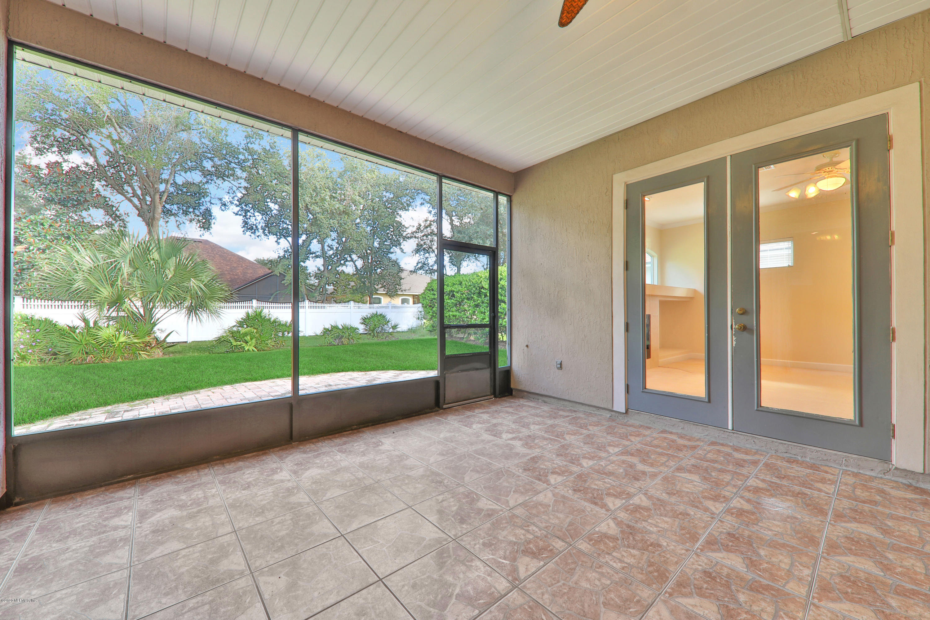 804 Riley Lane St. Augustine, FL 32095 - Photo 12 of 35 a view of an empty room with floor to ceiling windows with yard