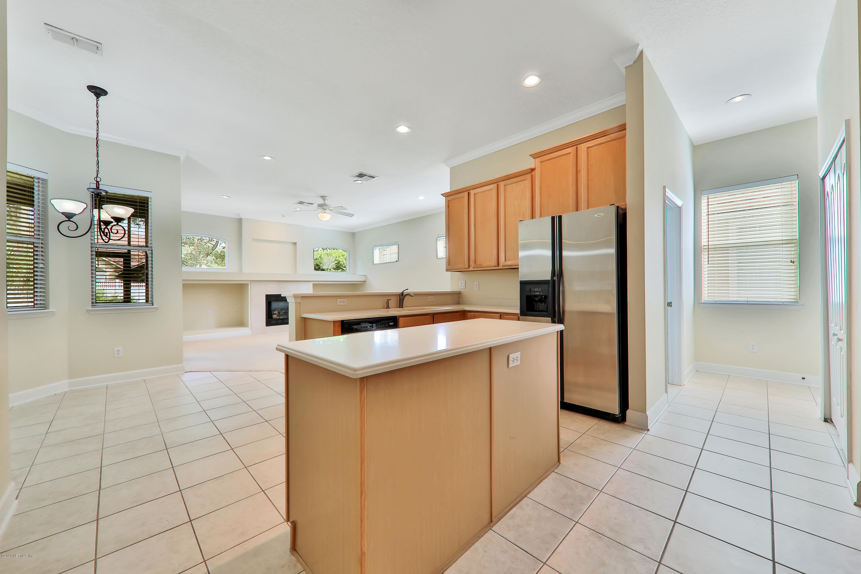 804 Riley Lane St. Augustine, FL 32095 - Photo 26 of 35 a kitchen with stainless steel appliances a refrigerator sink and cabinets
