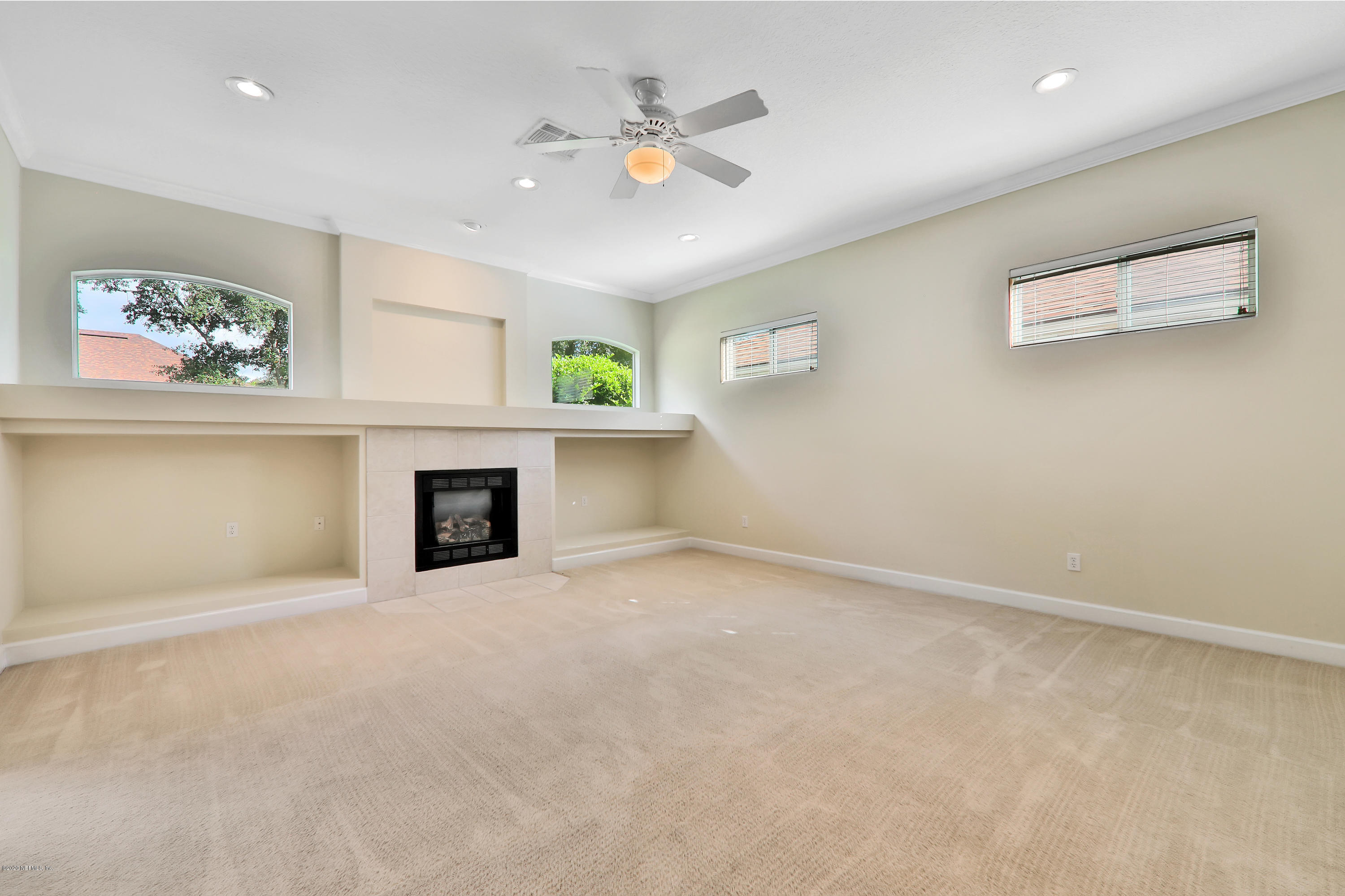 804 Riley Lane St. Augustine, FL 32095 - Photo 32 of 35 an empty room with windows and fireplace