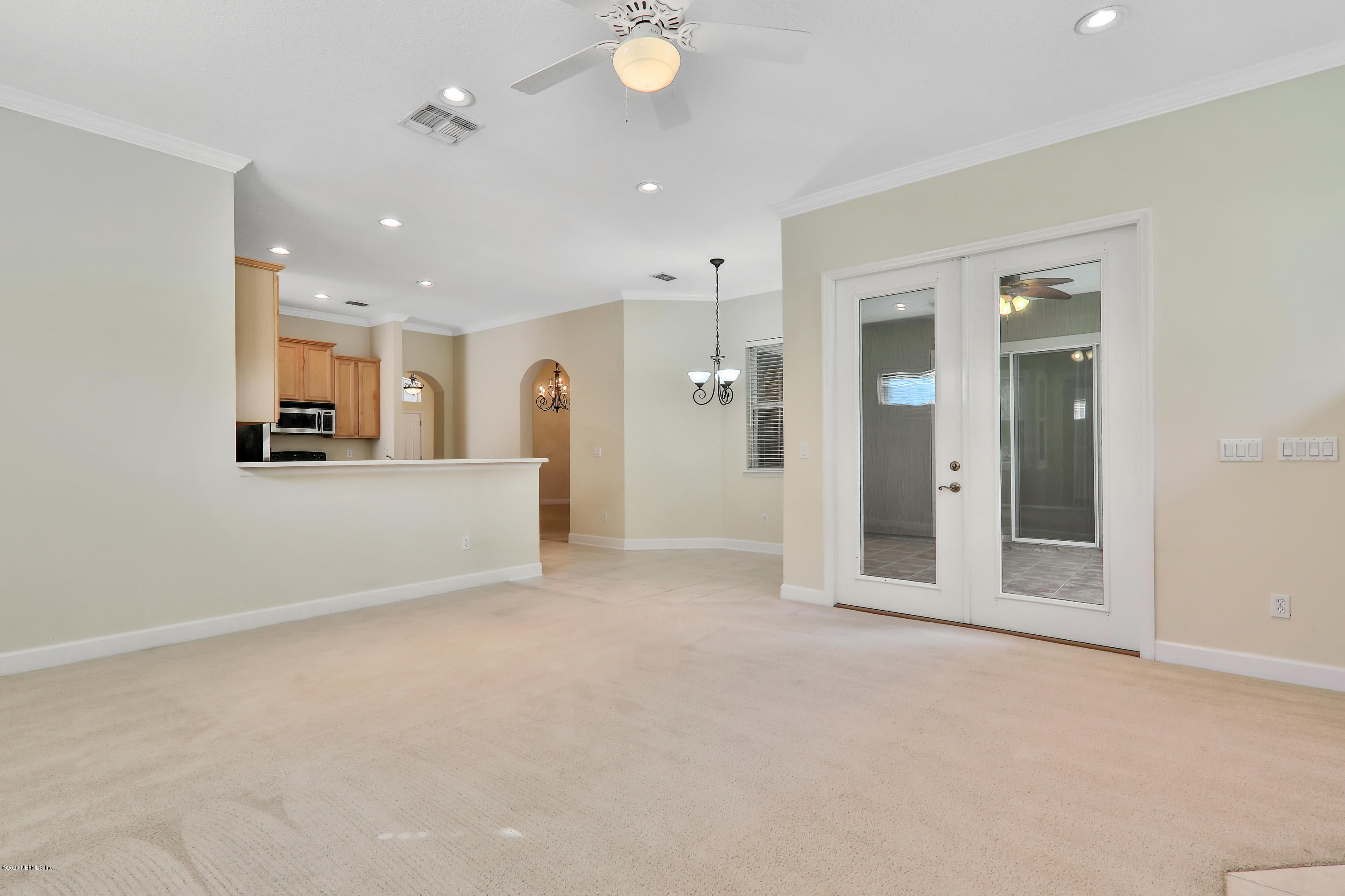 804 Riley Lane St. Augustine, FL 32095 - Photo 34 of 35 an empty room with a kitchen and windows