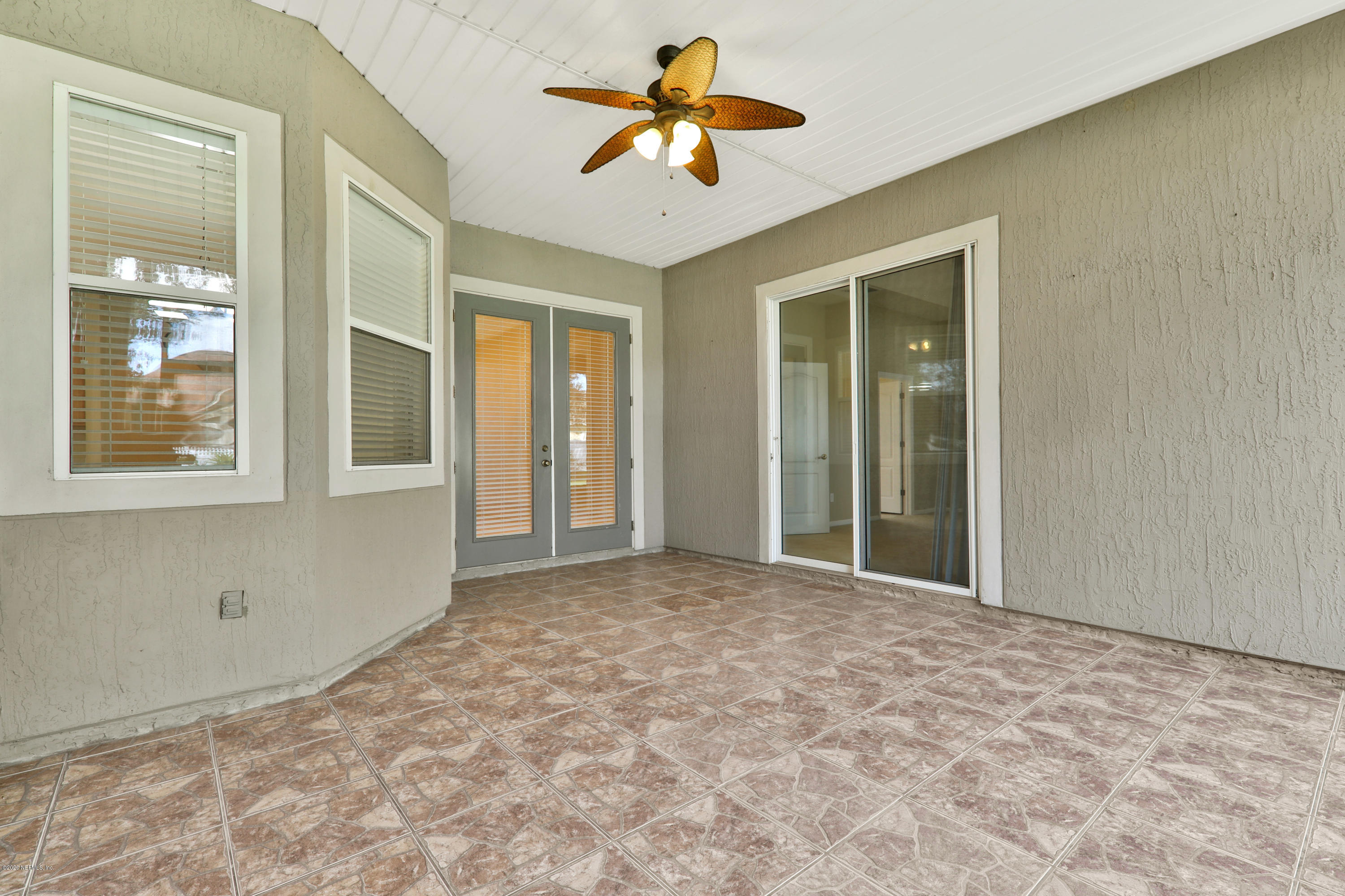 804 Riley Lane St. Augustine, FL 32095 - Photo 10 of 35 a view of a room with a chandelier fan and windows