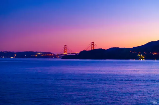 a large white building with a view of living room