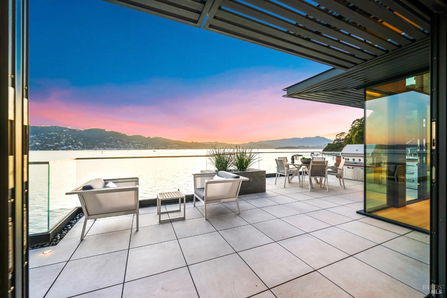 46 Cliff Road Belvedere, CA 94920 - Photo 14 of 42 a roof deck with table and chairs a barbeque