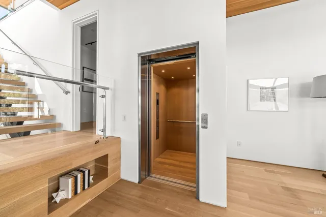 a bedroom with a large bed and a large window