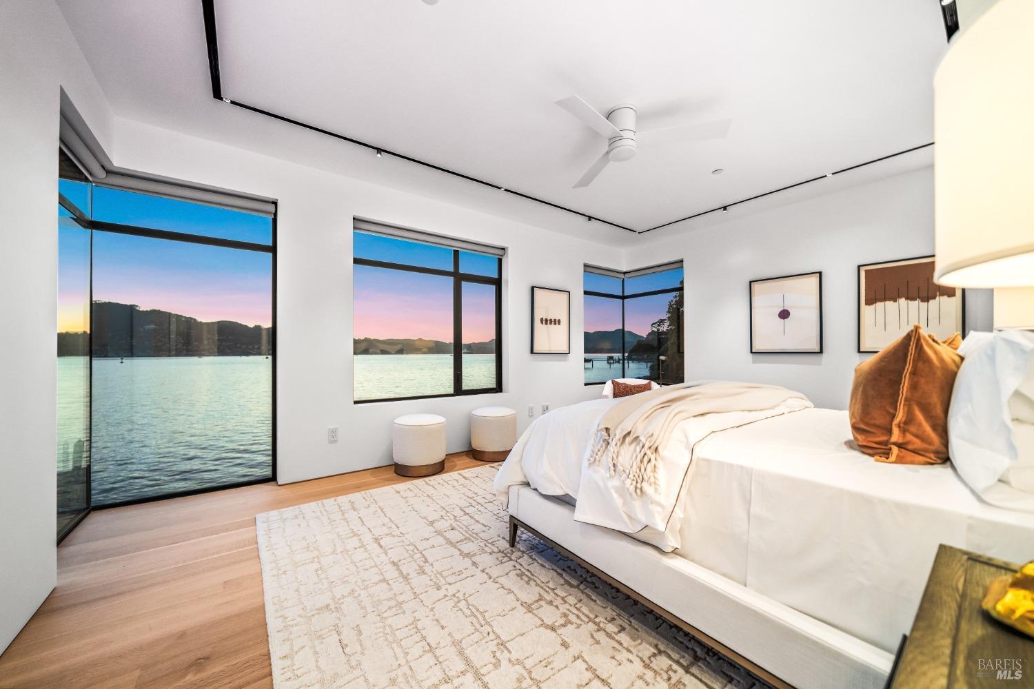 46 Cliff Road Belvedere, CA 94920 - Photo 17 of 42 a bedroom with a large bed and a large window