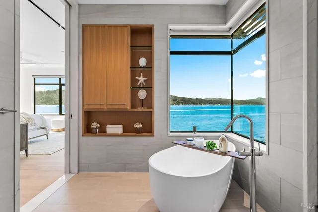 a room with a bed and a large window