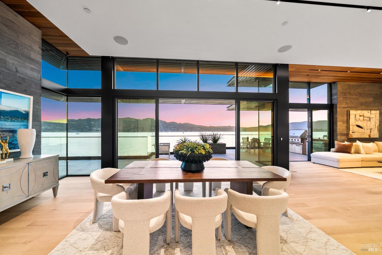 46 Cliff Road Belvedere, CA 94920 - Photo 3 of 42 a view of a dining room with furniture large windows and wooden floor