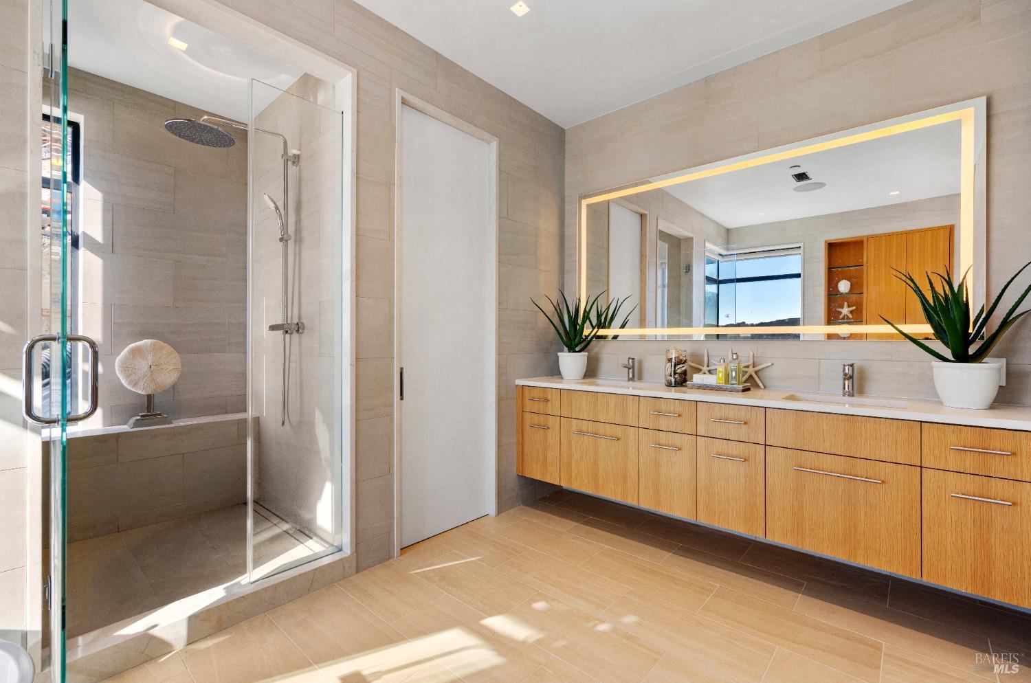 46 Cliff Road Belvedere, CA 94920 - Photo 33 of 42 a spacious bathroom with a double vanity sink and a mirror