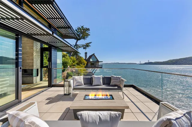a view of a lake with a house in the background