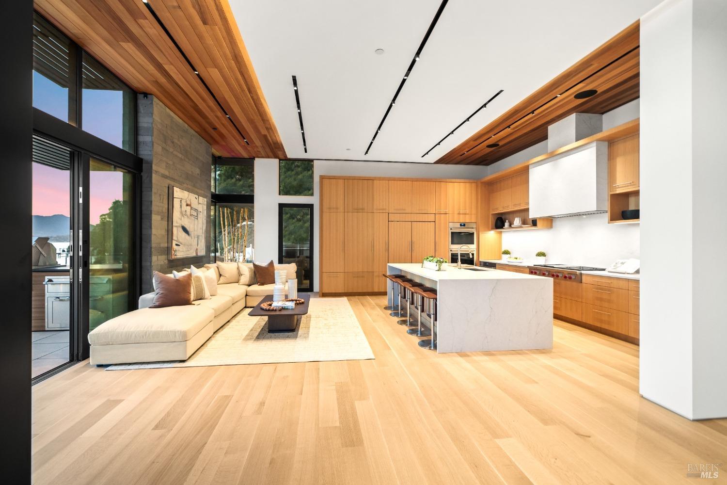 46 Cliff Road Belvedere, CA 94920 - Photo 8 of 42 a large room with stainless steel appliances kitchen island granite countertop a large kitchen counter top space a sink a refrigerator and windows