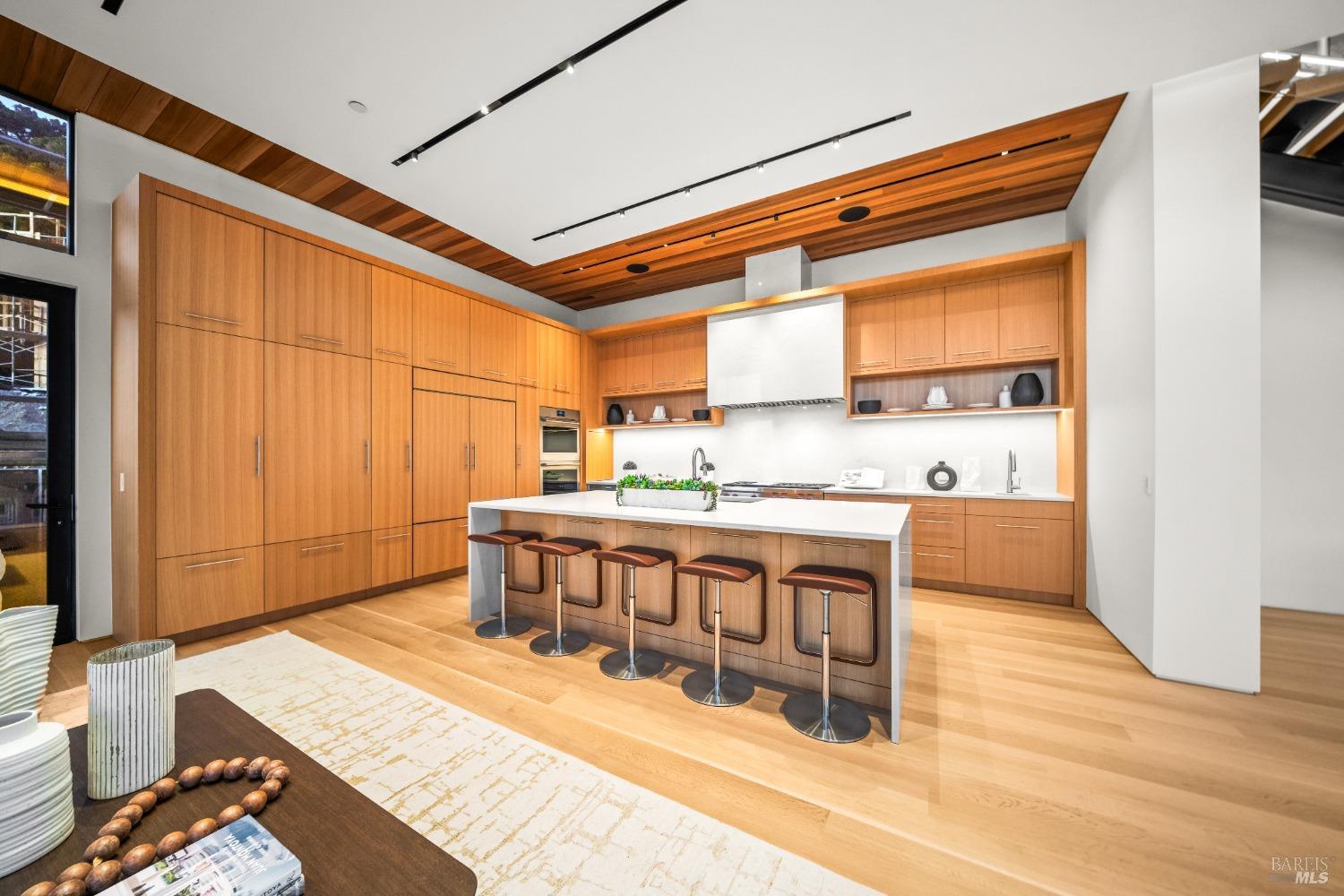 46 Cliff Road Belvedere, CA 94920 - Photo 9 of 42 a living room with stainless steel appliances kitchen island granite countertop furniture and a wooden floor