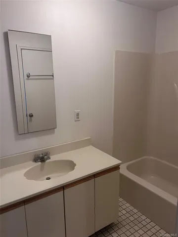 a bathroom with a sink and a bathtub