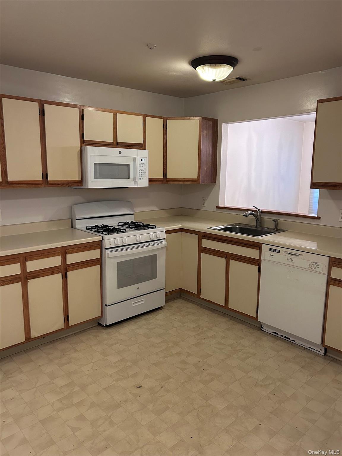 6 Olde Wagon Road Warwick, NY 10990 - Photo 6 of 14 a kitchen with stainless steel appliances granite countertop a stove a sink and a microwave