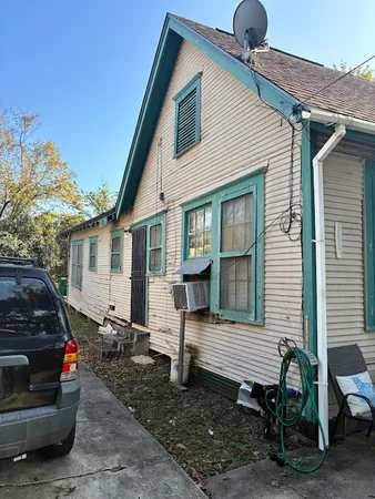 a view of a house with a door and a fire pit