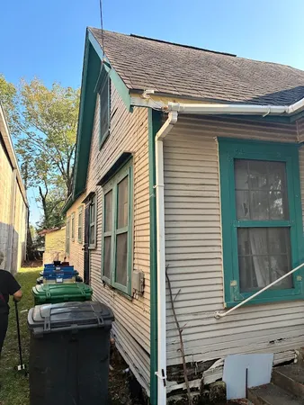 a view of backyard with swimming pool and outdoor seating