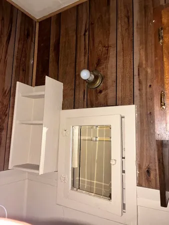 a dining room with furniture and a potted plant