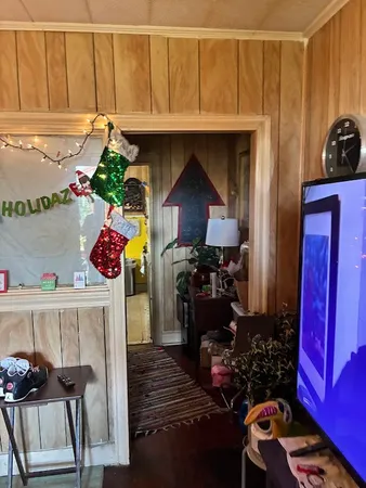 a kitchen with a stove and a wall painting